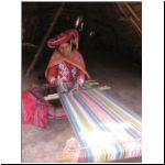 43 weaving cloth on loom.jpg